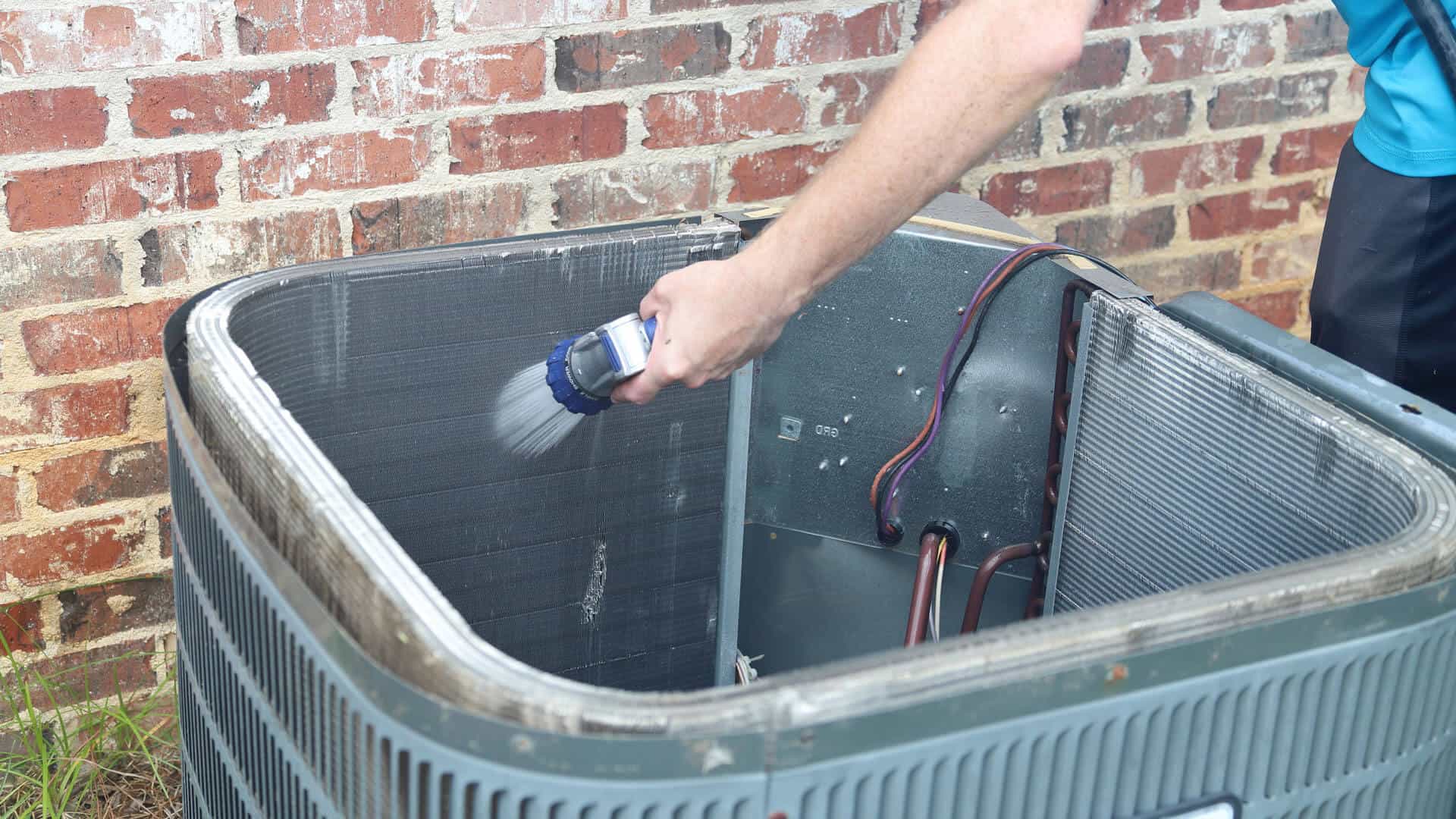 hand-cleaning-air-conditioner-condenser-coils